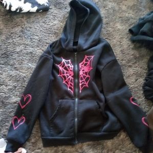 medium black jacket with pink design from shein, used a few times